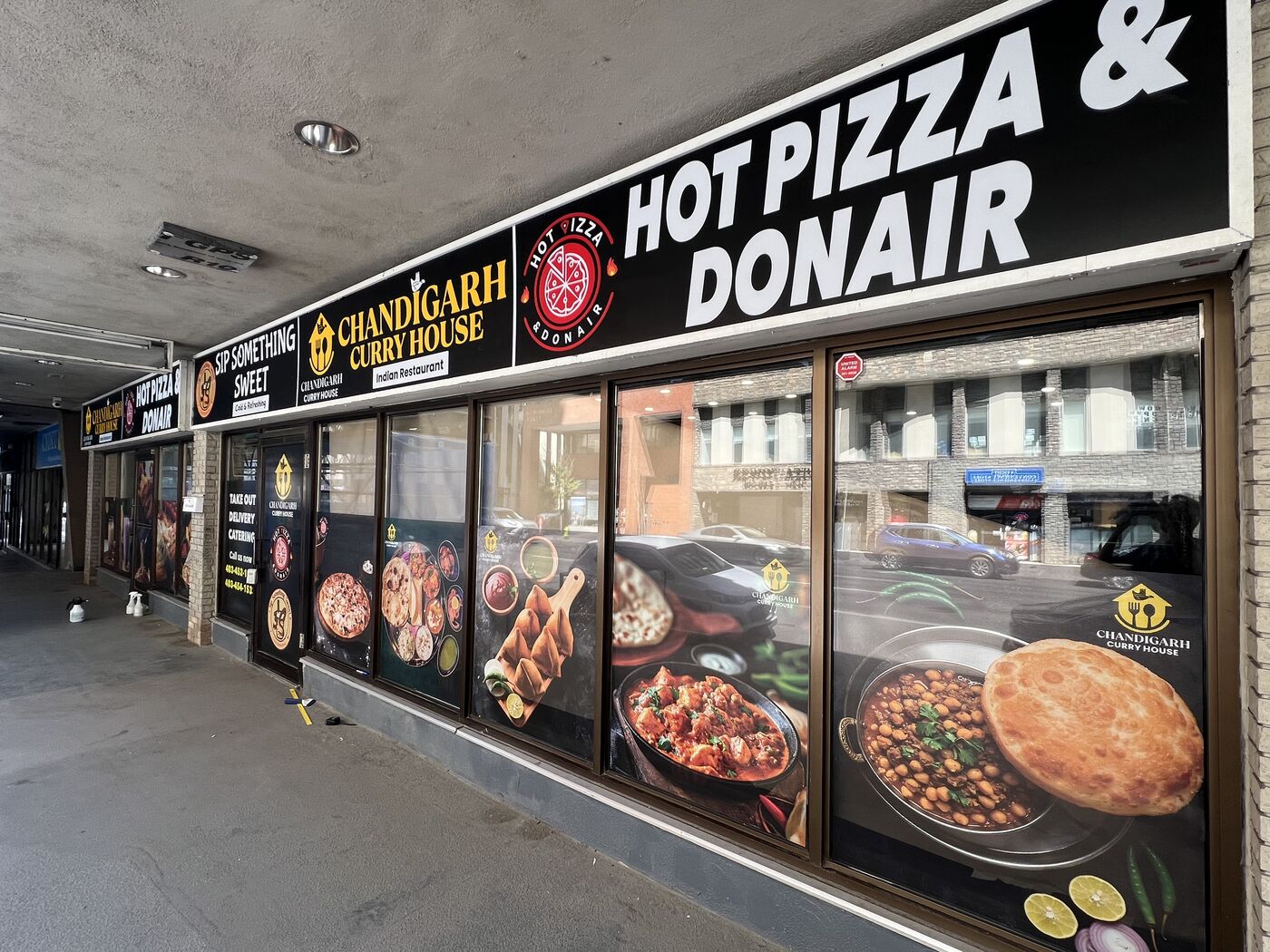 Illuminated restaurant fascia signs and window graphics in Calgary — Action Signs & Graphics