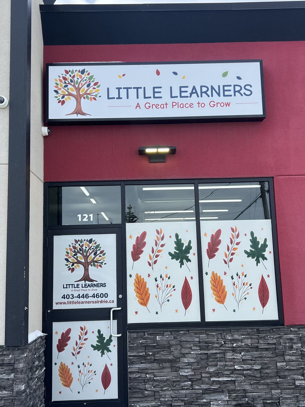 Illuminated daycare box sign with door and window vinyl — Action Signs & Graphics