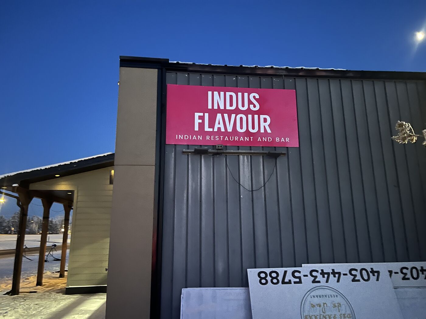 Exterior restaurant wall sign installation — Action Signs & Graphics